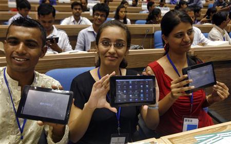 Students display Aakash after launching ceremony in New Delhi