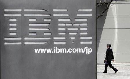 A man walks past the headquarters of IBM Japan in Tokyo